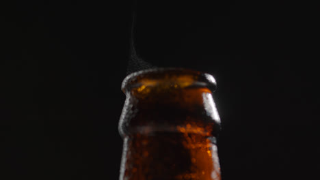 Close-Up-Of-Condensation-Droplets-On-Neck-Of-Bottle-Of-Cold-Beer-Or-Soft-Drink-With-Water-Vapour-After-Opening